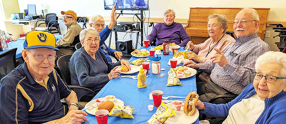 All Saints Assisted Living folks celebrate Opening Day of baseball season.
