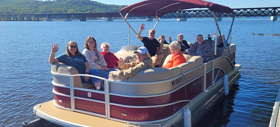 All Saints Memory Care folks on pontoon ride on Lake Wisconsin.